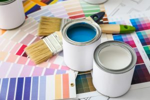 Two Cans of Blue and White Paint with Palettes