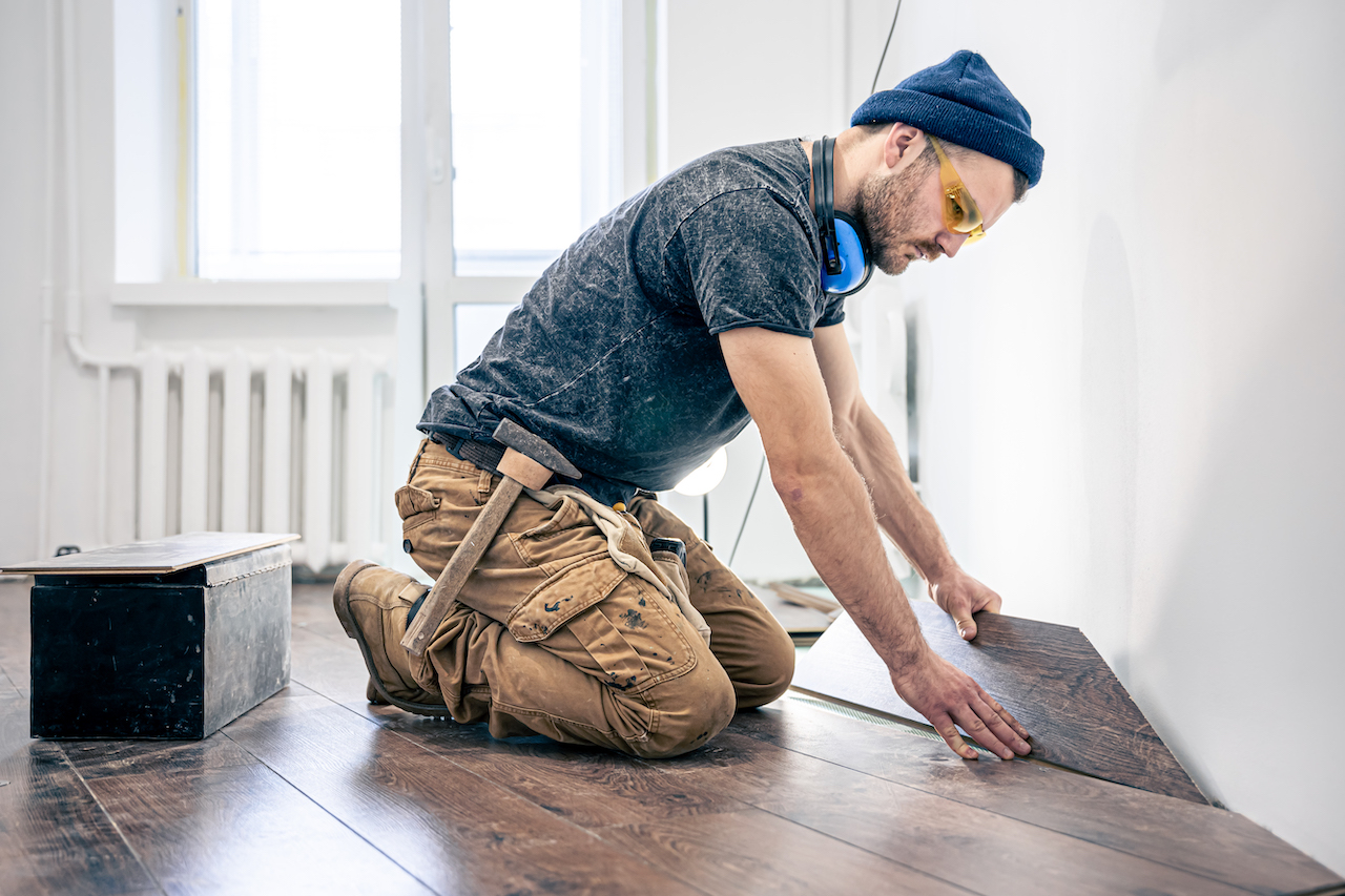 flooring professional installing new floors in room