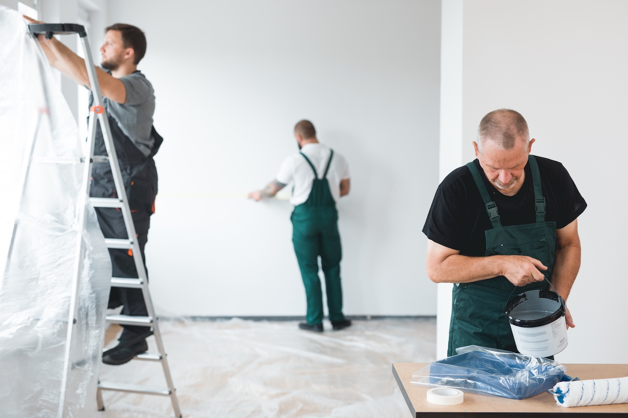 Professional Painters in a room preparing to paint