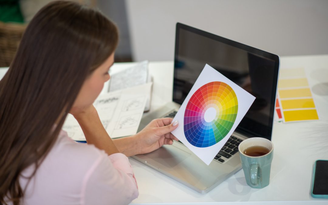 Woman using a color wheel to paint match